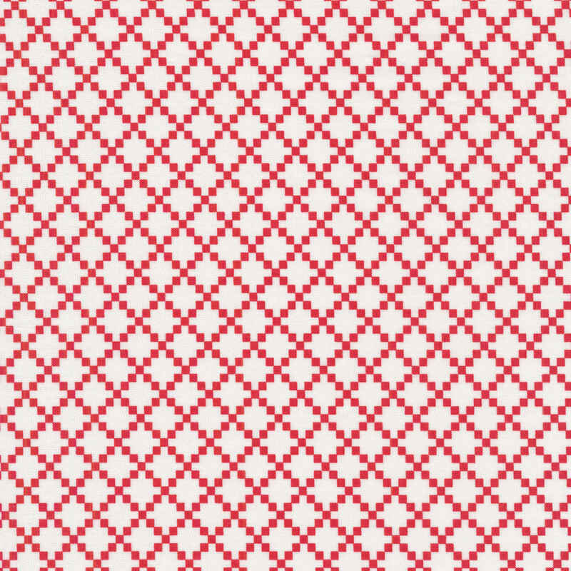 Red fabric covered with white lattice made up of small diamonds