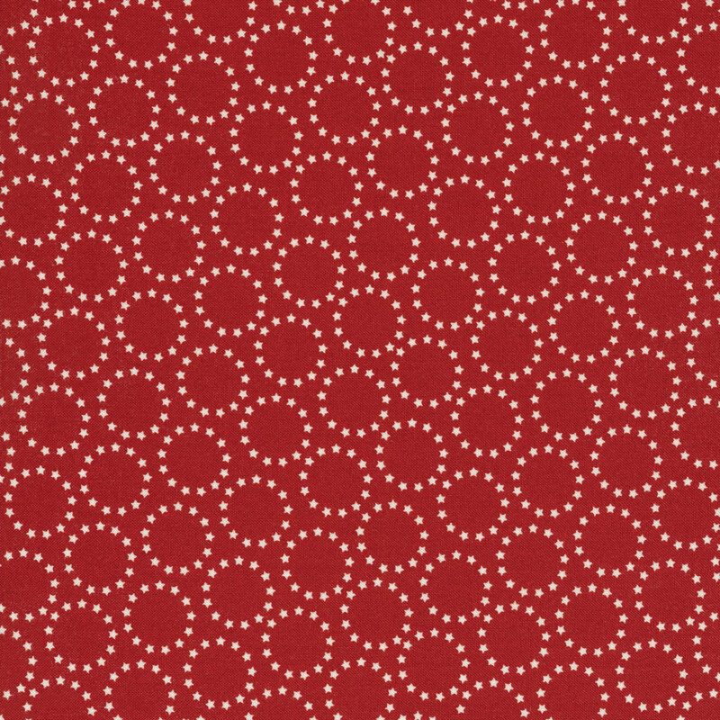red fabric with white circles made up of tiny stars