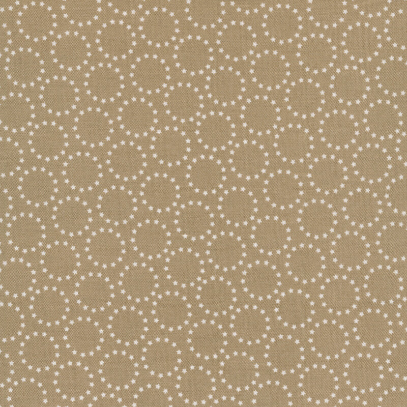 taupe fabric with white circles made up of tiny stars