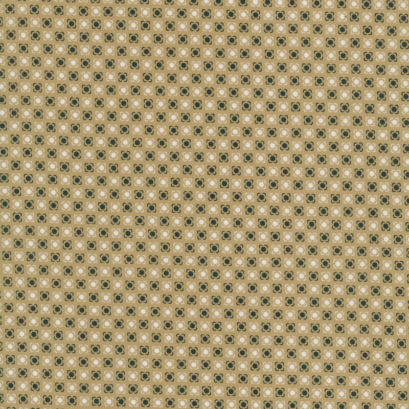 taupe fabric with navy dots with small brackets around each, looking almost flower-like with white dots in between 