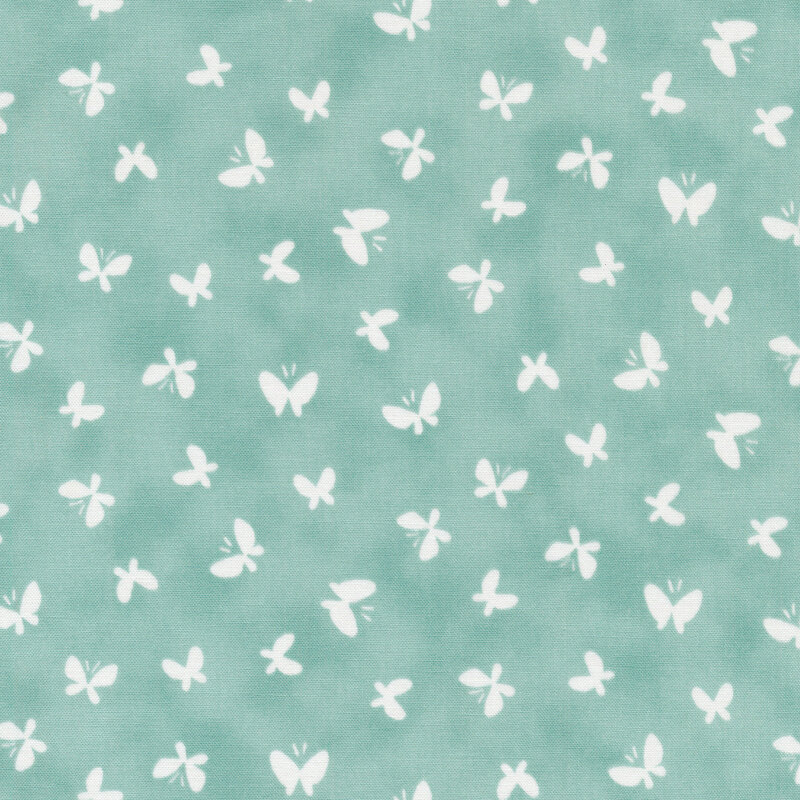 Light blue mottled fabric with white ditsy butterflies all over