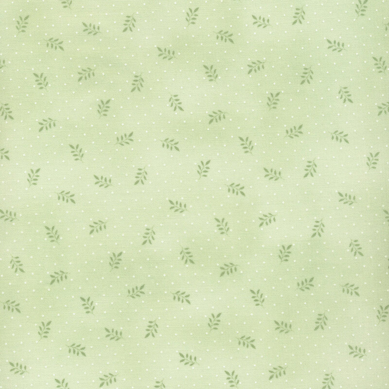 fabric with small green leaves on a mottled light green background