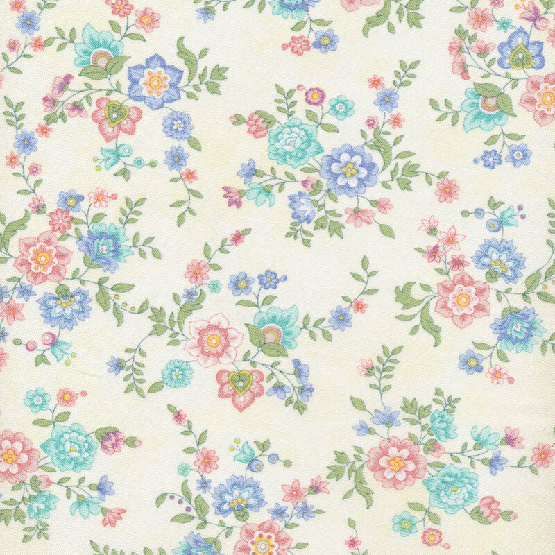 fabric with pink and blue flowers on a cream colored background 