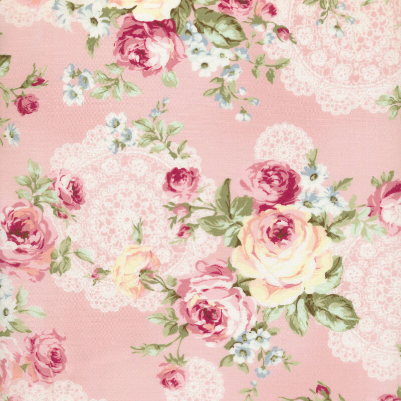 cream and pink roses on a pink background with cream lace