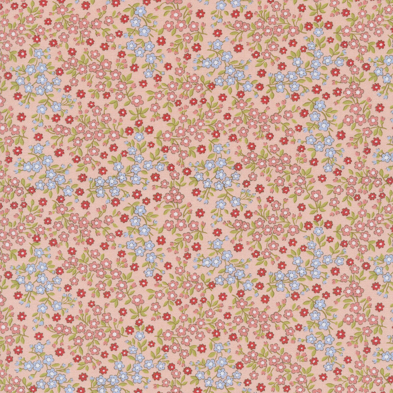 dusty pink fabric with small packed flowers in blue, pink, and red with green leaves
