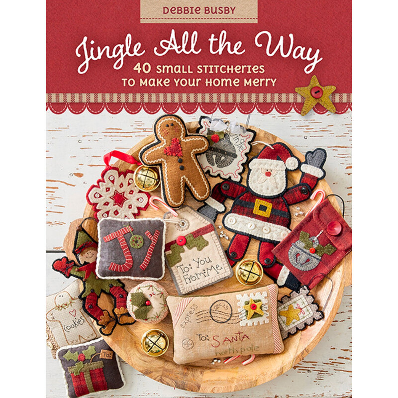 front of Jingle All The Way book featuring a wooden tray covered in finished projects
