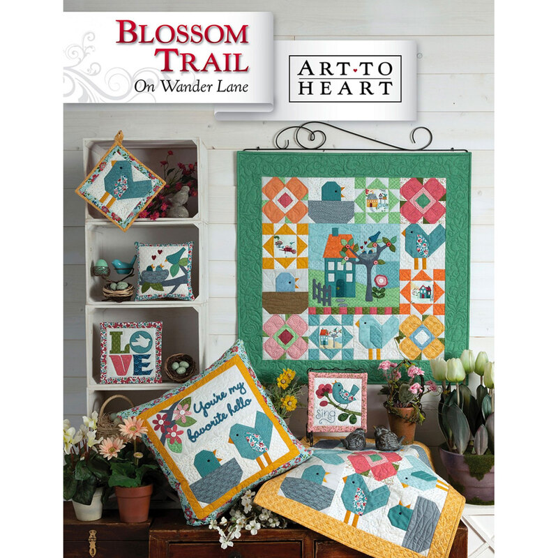 Front of Blossom Trail pattern, showing the finished quilt staged as a wall hanging
