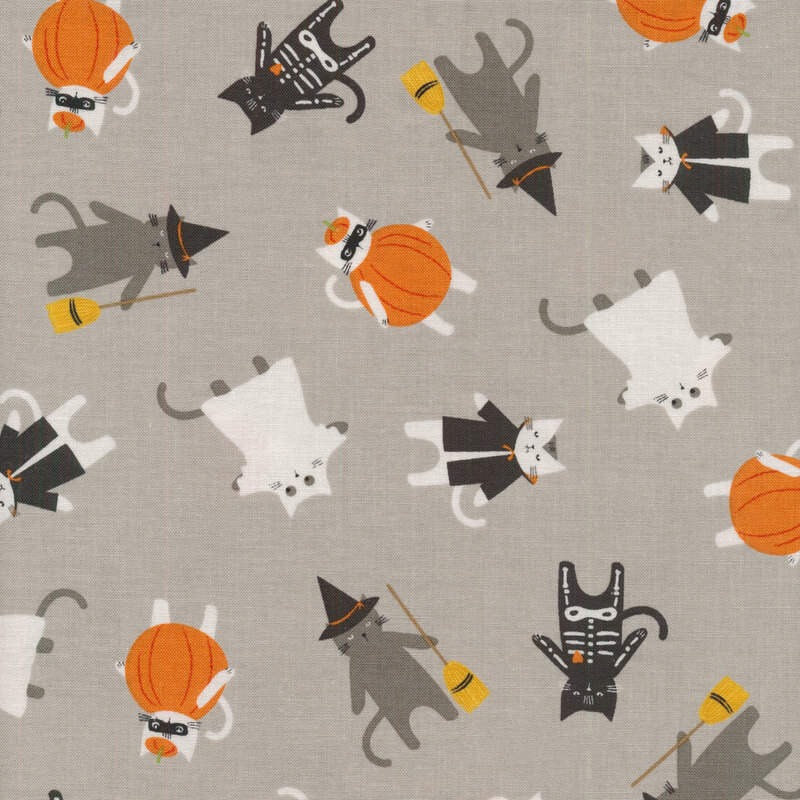 Gray fabric with cartoon cats all over in different costumes of classic Halloween monsters: Vampire, Ghost, Witch, Skeleton, Pumpkin, etc.