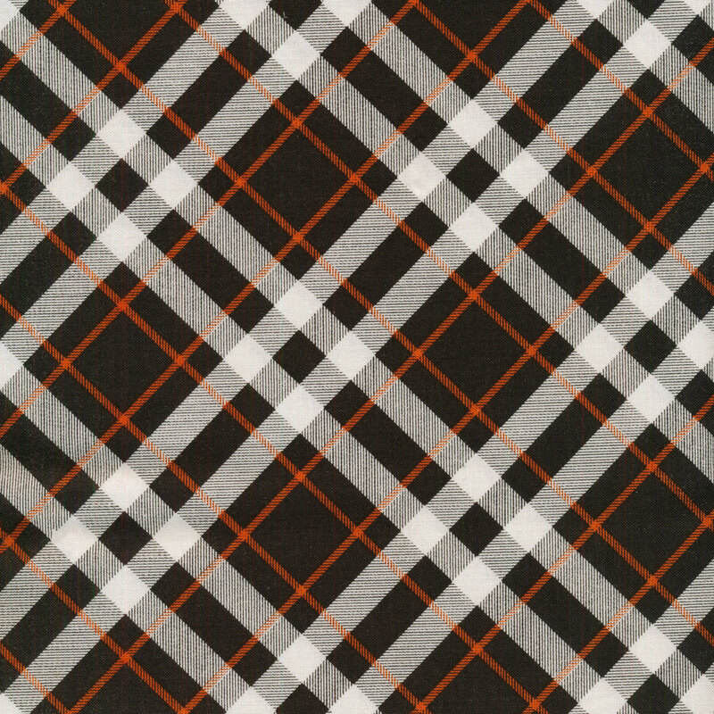 Black plaid fabric with white and orange intersecting lines