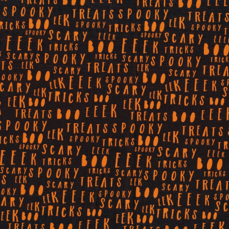 Black fabric with orange lettering all over with Halloween associated words like 