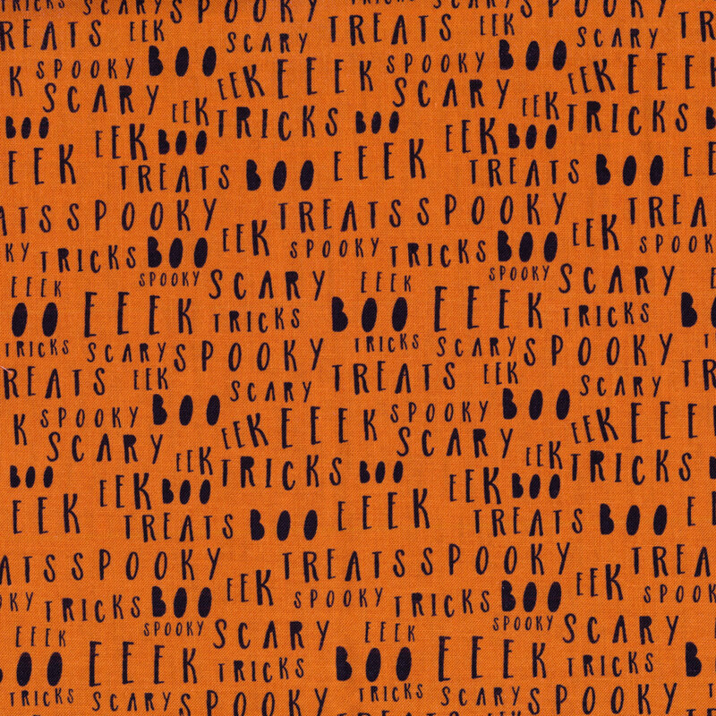 Orange fabric with black lettering all over with Halloween associated words like 