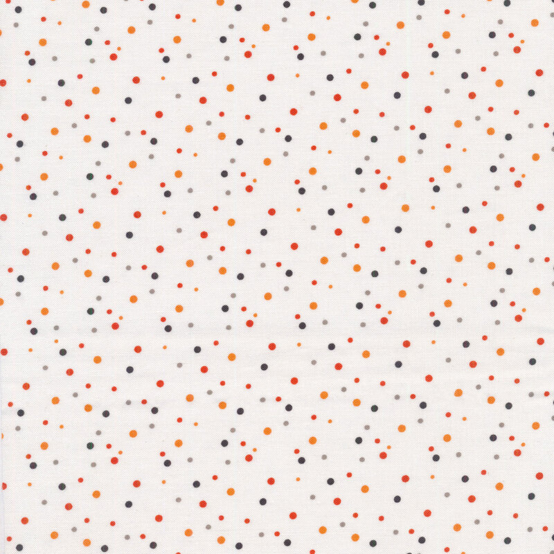White fabric with orange and black dots all over