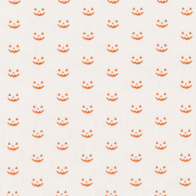 White fabric with rows of staggered orange jack o'lantern faces