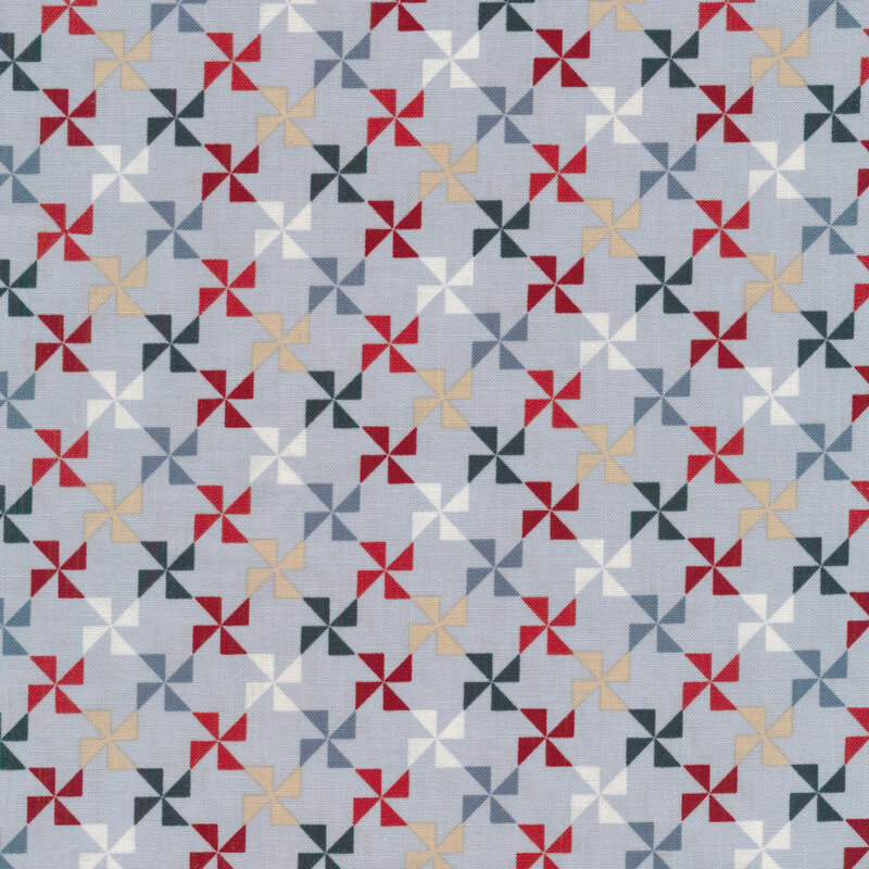 red, tan, navy blue and light blue pinwheels on a blue gray background