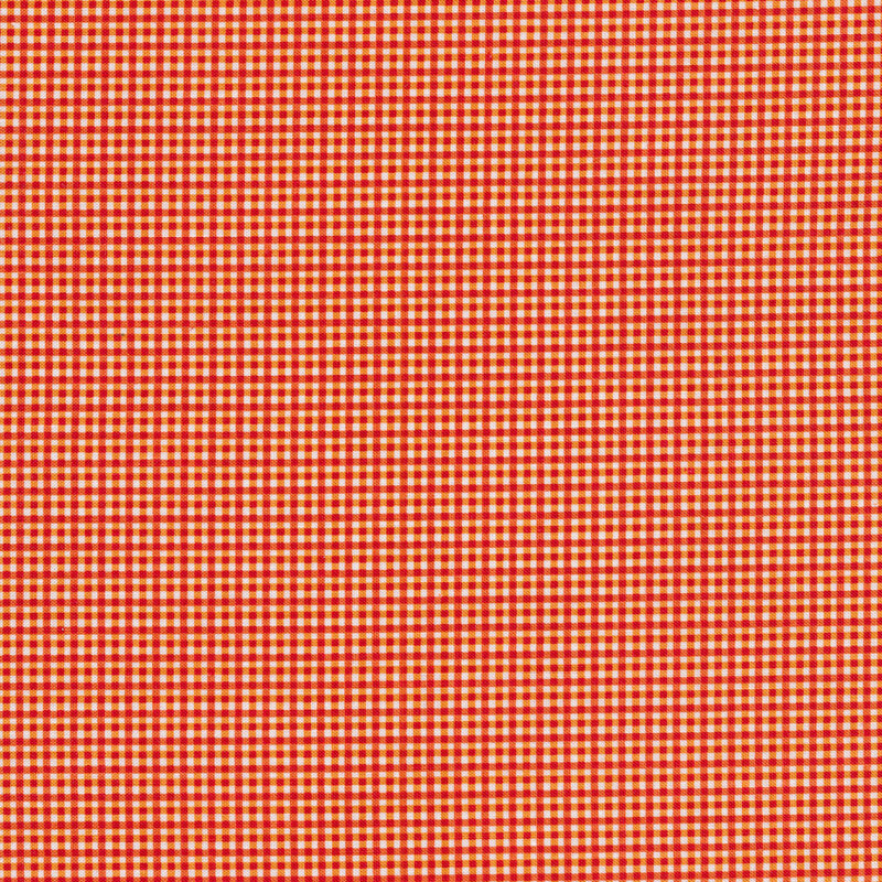 This fabric features a small diagonal orange plaid print on a white background