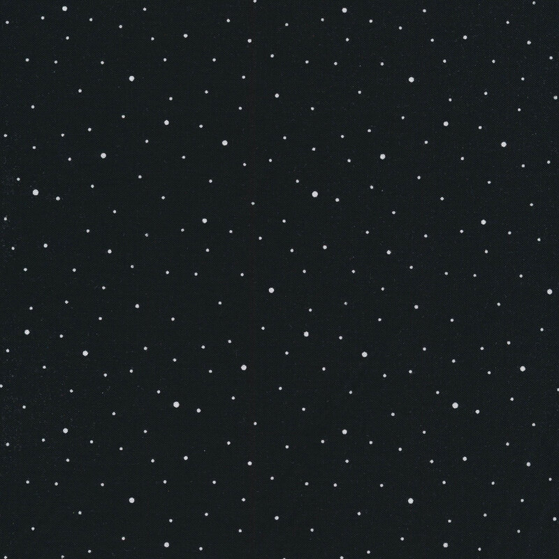 A solid black fabric with small white dots of varying sizes