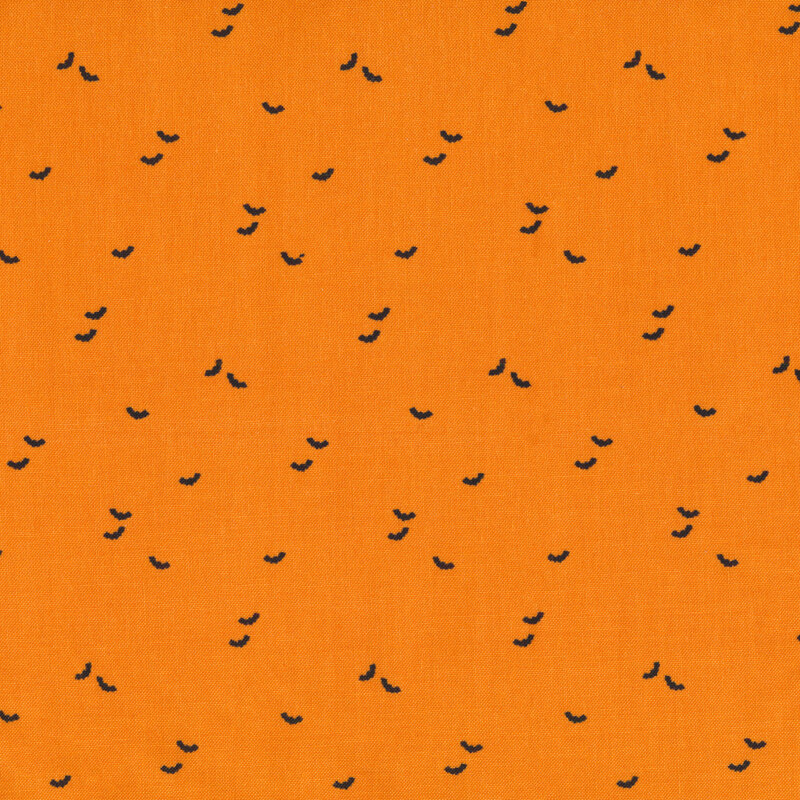 Orange fabric with small black bats all over
