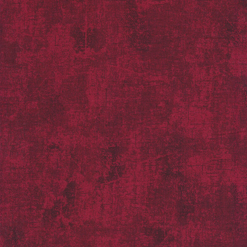 deep red fabric with a mottled design and tonal cracked canvas texture