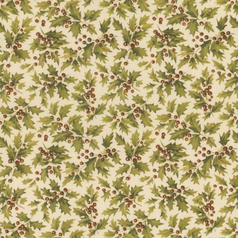 Tossed green holly berries and leaves on a cream background