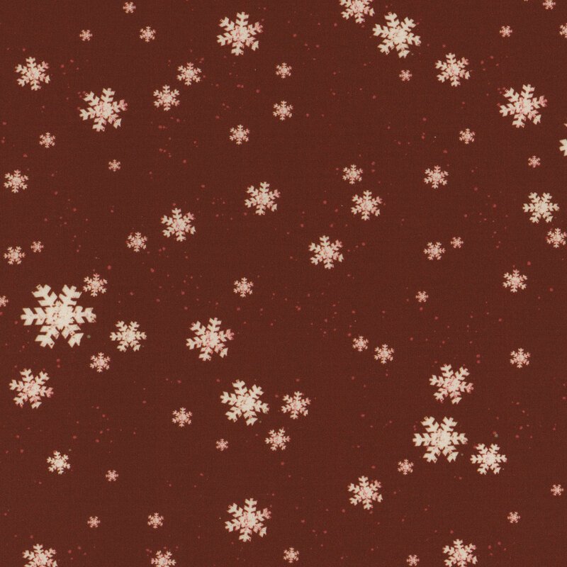 Small white snowflakes on a solid red background