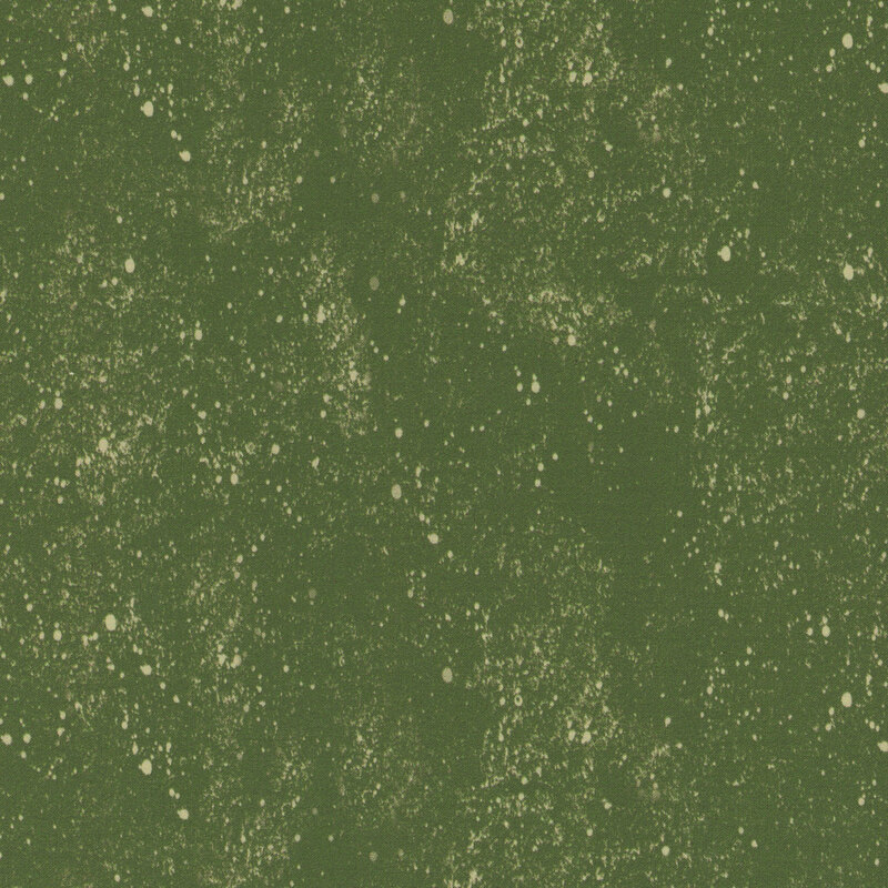 A solid green fabric with a light cream paint splatter pattern all over