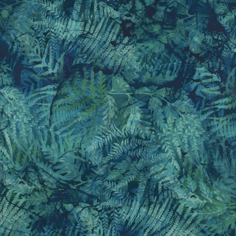 Fabric with marbled blue and teal fern leaves on a deep blue background