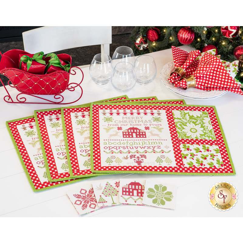 Placemats featuring a Christmas themed cross stitch sample panel print.