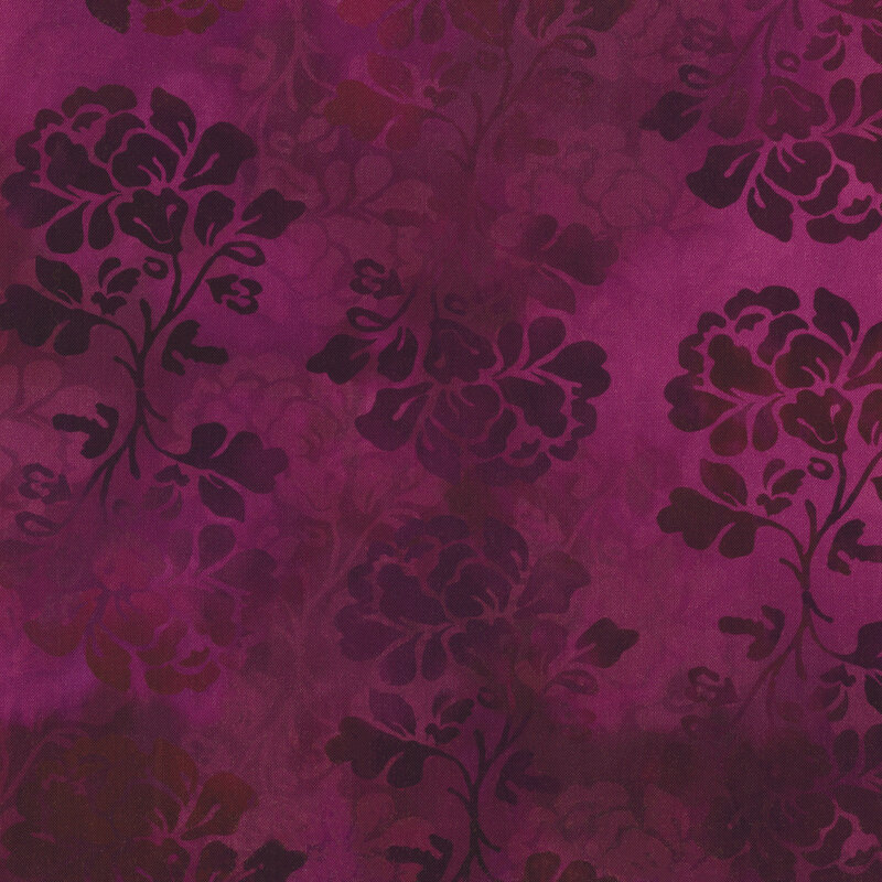 subtly variegated pink and purple fabric with floral silhouettes all over