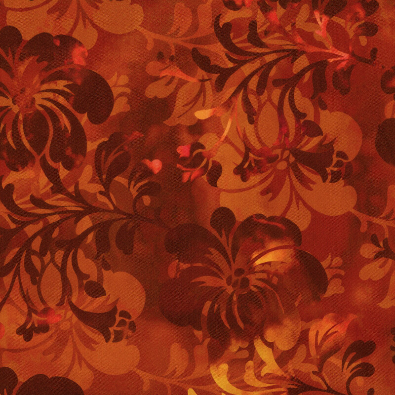subtly variegated orange fabric with dark floral silhouettes all over