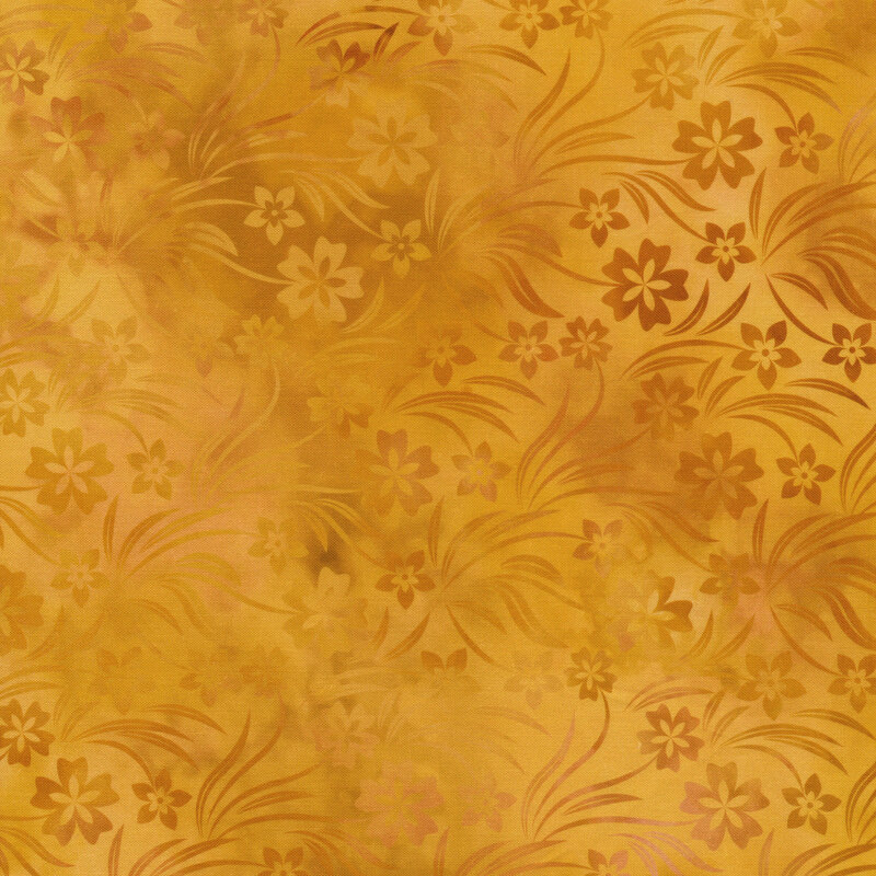 variegated yellow fabric with mottled floral silhouettes all over