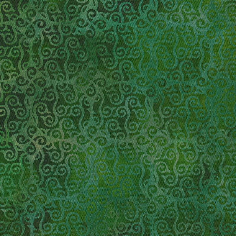 Variegated green fabric with large circles and swirls all over