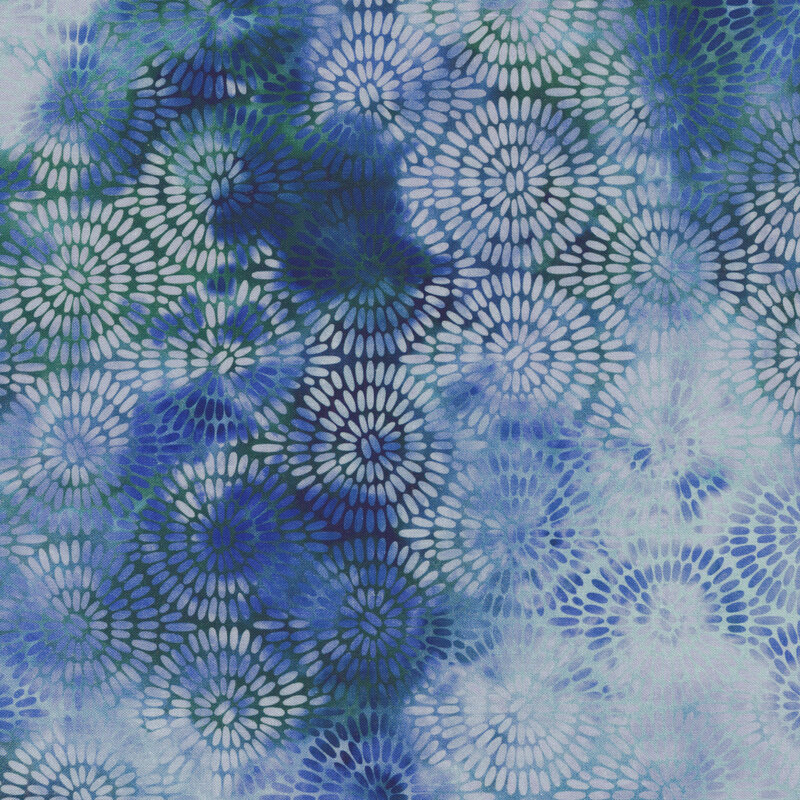 variegated blue fabric with concentric circles made up of small dashes