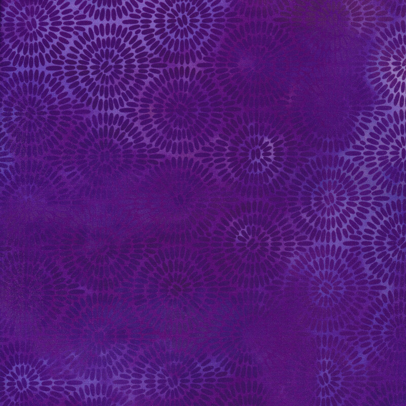 variegated purple fabric with concentric circles made up of small dashes