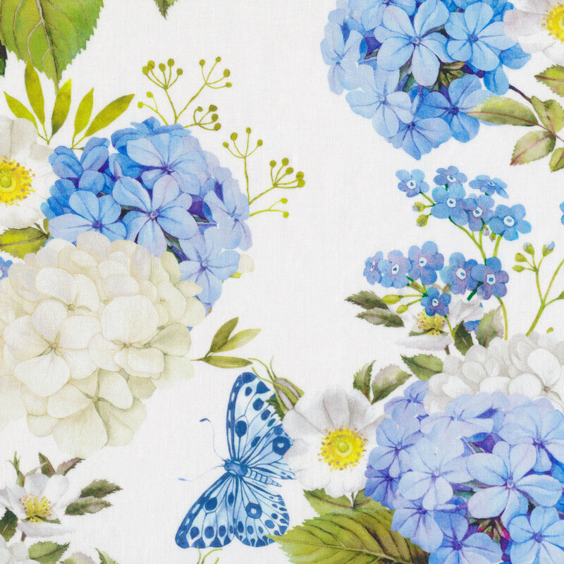 White fabric with large floral print with blue and white flower clusters and a blue butterfly