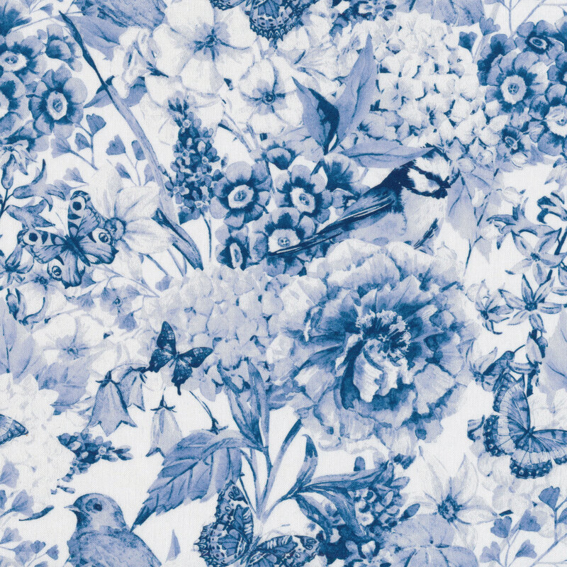 fabric with blue and white monotone imagery of flowers, birds and butterflies packed together