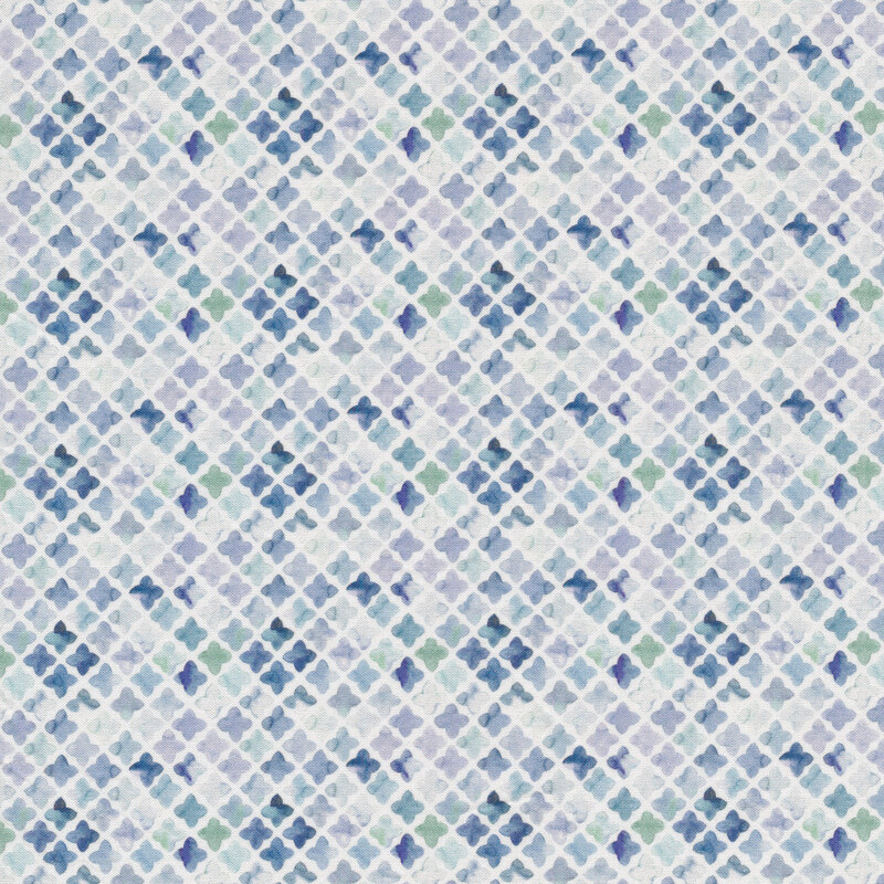 Fabric with a tiled design that creates a lattice in varying shades of blue on a white background