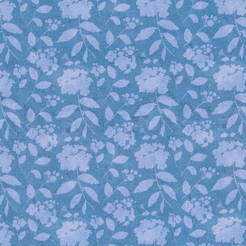 Blue tonal fabric with light silhouettes of flower bunches and long stems with leaves