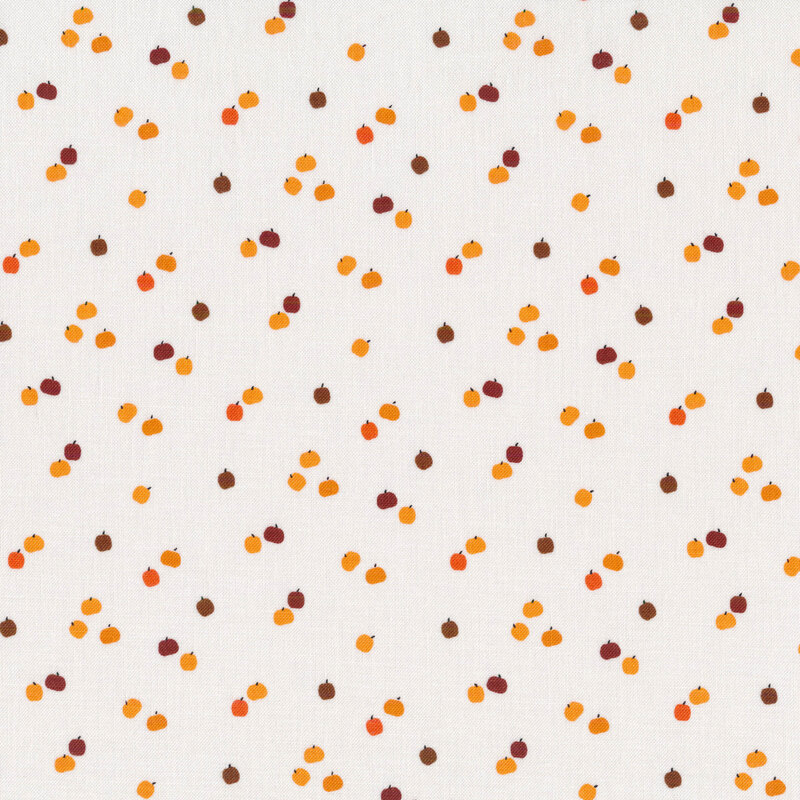 White fabric with tiny brown and orange pumpkins all over