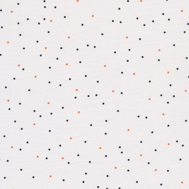 white fabric with scattered black and orange dots