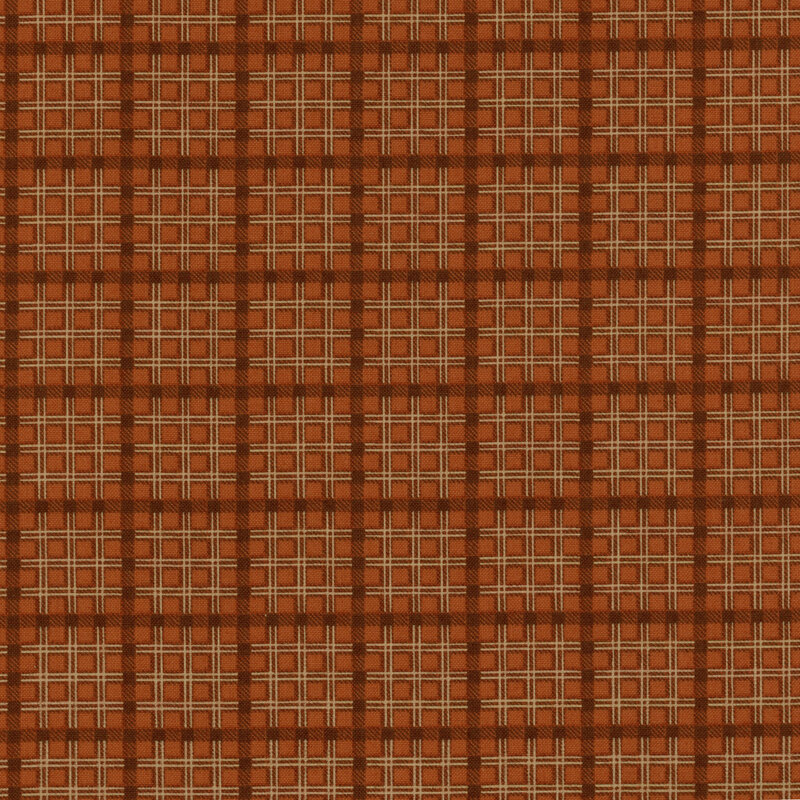Scan of fabric featuring burnt orange and white plaid patterned fabric