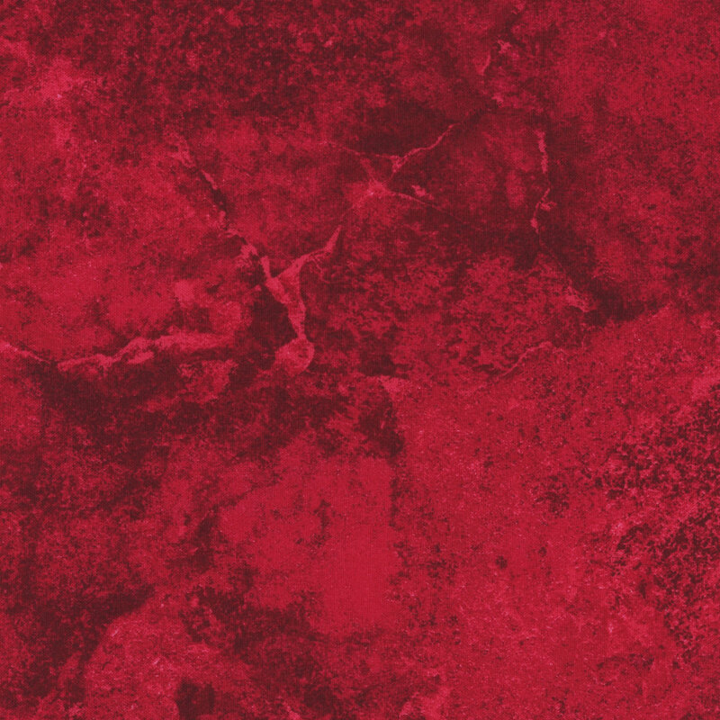A tonal red fabric with a marbled and mottled look