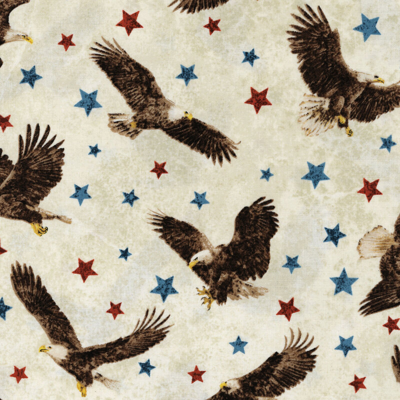 An off white fabric with red and blue stars all over with scenes of bald eagles flying