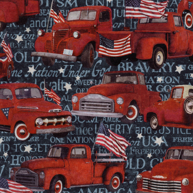 A navy blue digitally printed fabric covered in red vintage trucks with stars and American flags