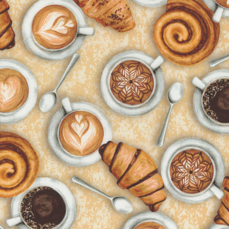 Fabric with top down cups of coffee, spoons, and croissants scattered on a mottled cream background