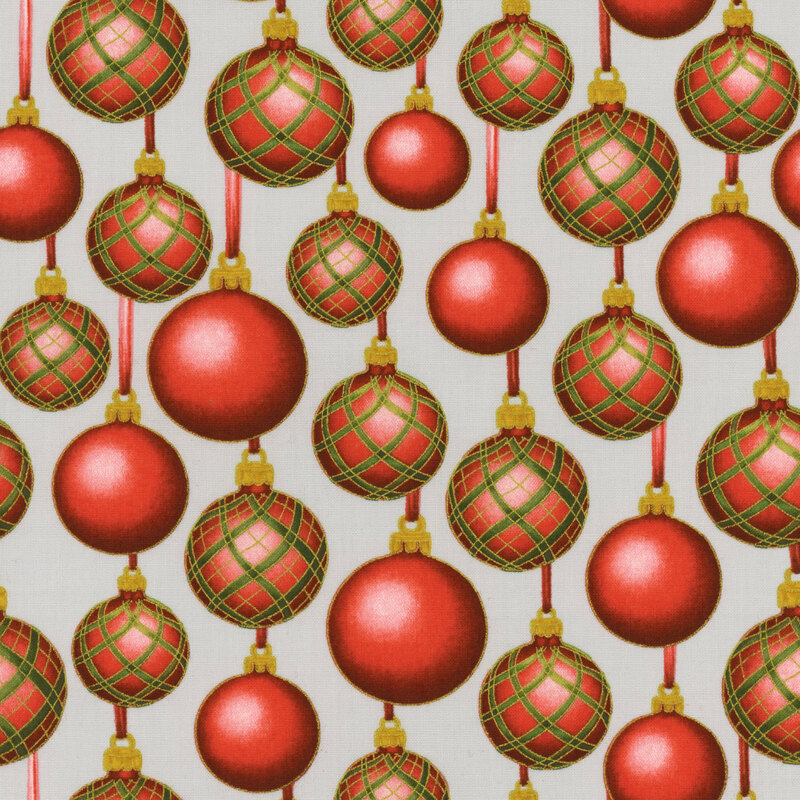 Christmas fabric featuring large red ornaments with gold metallic accents against a gray background