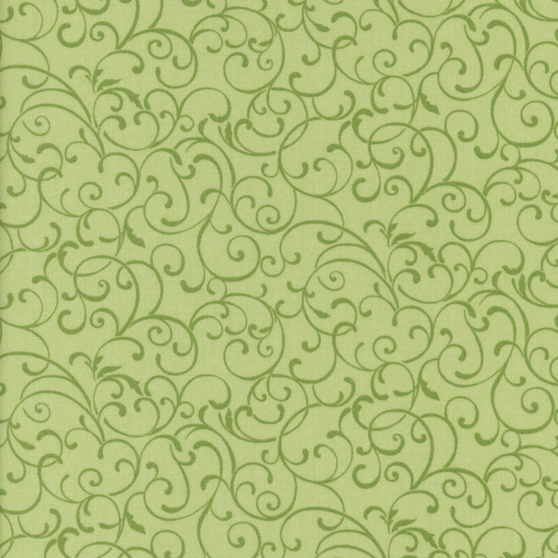 Light green fabric with dark green swirls and scrolls all over