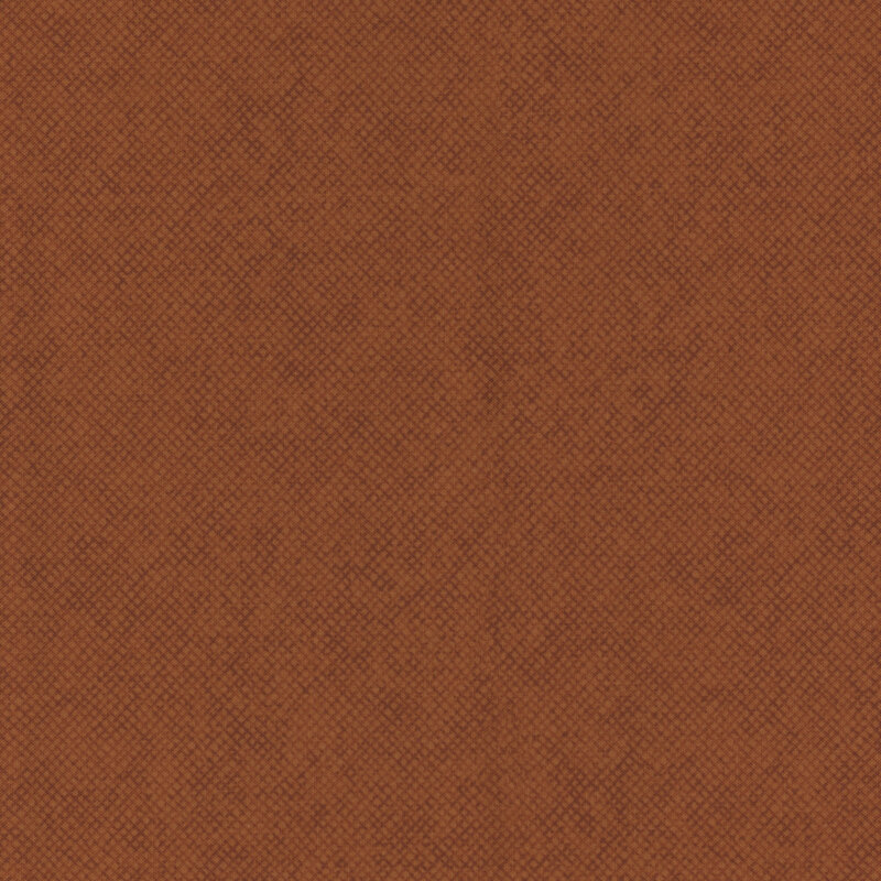 A burnt orange brown fabric with a tonal textured crosshatch design