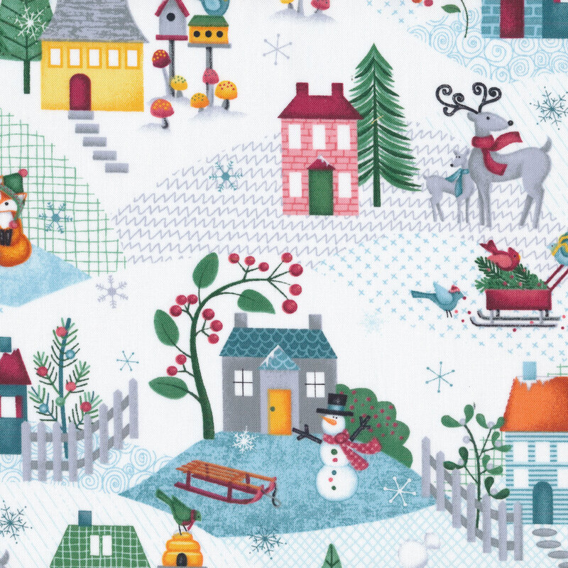 Fabric with colorful scenes of winter including homes with picket fences, reindeer, foxes wearing winter hats, and snowflakes