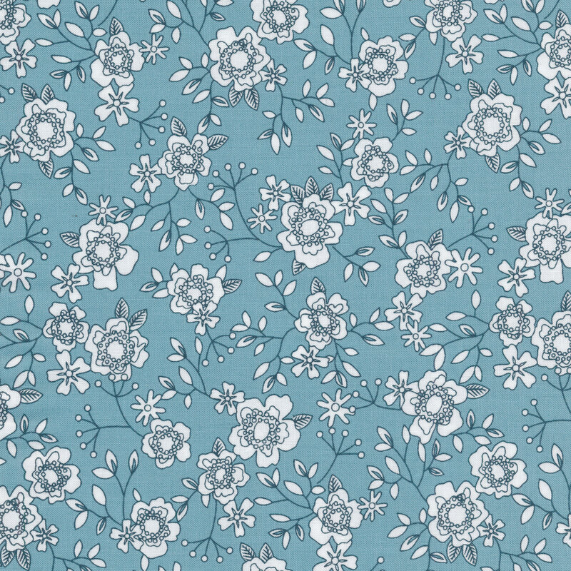 Blue fabric with small black and white white flowers all over