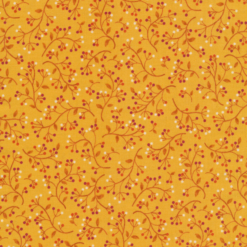 Yellow fabric with orange vines and circular red, orange, and white flower buds